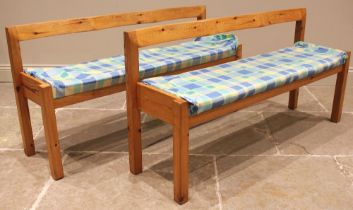 A pair of Habitat pine benches, late 20th century, each with a wavy rail back, upon legs of square