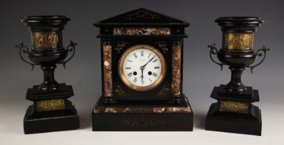 A Victorian polished slate clock garniture, comprising; a mantel clock, signed ‘R. Russell,