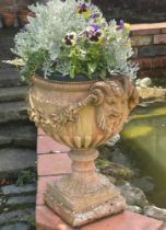 A pair of terracotta garden urns, moulded in relief, with horned masks and swags, 49cm H x 33cm D (2
