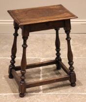 An 18th century style jointed oak stool, the rectangular top upon slender baluster, bobbin turned