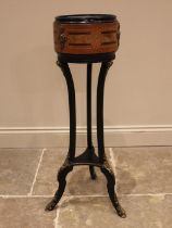 A Louis XV style walnut and ebonised jardiniere stand, late 19th century, of cylindrical form with