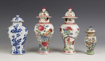 A pair of Chinese porcelain vases and covers, 20th century, in the famille rose palette and of