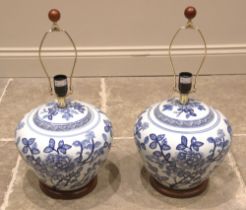 A pair of Ralph Lauren Chinese influence blue and white vase table lamps, of tapering form upon