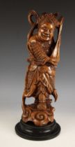 A large Chinese carved wood figure, 19th century, modelled as a scholar playing a lute, 43cm high,