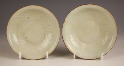 A pair of Qingbai celadon saucer dishes, possibly Song dynasty, each small shallow dish with moulded
