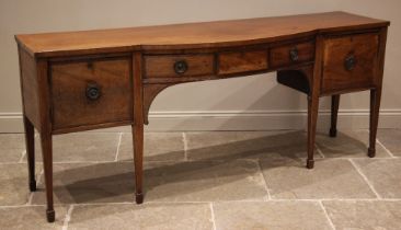 A Regency mahogany sideboard, of break arch form, outlined with boxwood stringing, the central