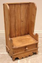 A Welsh child's pine lambing chair, 19th century and later, the high back with shaped wing backs