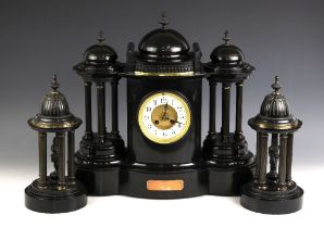 A large Victorian polished slate clock garniture, of architectural portico form, comprising; a