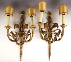 A pair of giltwood and gesso Rococo style twin branch wall sconces, 19th century, the tapering