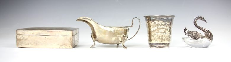 A George V silver sauce boat, Viner's Ltd, Sheffield 1936, the shaped rim above plain body upon