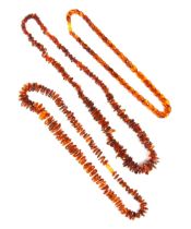 A selection of amber coloured jewellery, including a lozenge disc shaped necklace, the graduated '