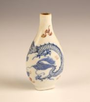 A Chinese porcelain blue and white snuff bottle, Kangxi (1662-1722), of slender compressed bottle