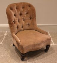 A Victorian button back child's chair, the arched padded back over a sprung serpentine seat, upon