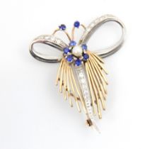 A 9ct white and yellow gold stylised spray brooch, the central flowerhead motif set with blue stones