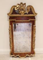 A George II style walnut, giltwood and gesso wall mirror, 19th century, the openwork acanthus