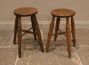 A near pair of elm Boston stools, late 19th century, the circular seats upon ring turned baluster