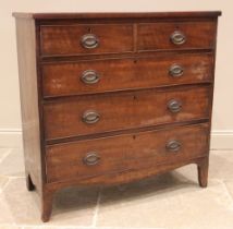 An early 19th century mahogany straight front chest of drawers, formed with two short over three