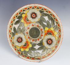 A Charlotte Rhead for Crown Ducal charger, early 20th century, the stylised floral centre surrounded