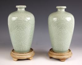 A pair of Chinese Longquan celadon vases, 20th century, each of meiping form, with incised floral