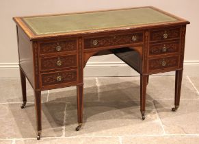 An Edwardian Sheraton Revival writing desk, by Edwards & Roberts, the rectangular top inset with a