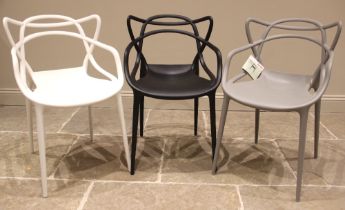 A harlequin trio of Kartell Masters stacking chairs, by Philippe Stark, each impressed with the