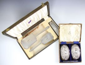 A George VI silver mounted dressing table set, W I Broadway & Co, Birmingham 1939, comprising a hair