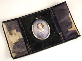 English school (early 20th century), A portrait miniature depicting a young lady dressed in purple