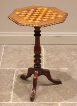 A Victorian walnut pedestal games table, the octagonal top inset with a rosewood and boxwood chess