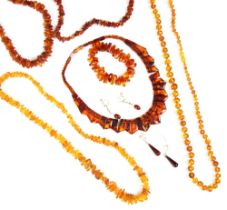 A selection of 'amber' coloured jewellery, including an 'amber' coloured collar style panel
