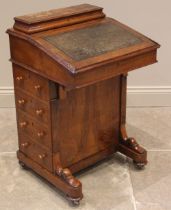 A Victorian figured walnut Davenport, with a hinged stationery compartment over a leather inset