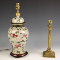 A Japanese Kutani porcelain lamp base, modelled as a temple jar, upon an integral hardwood stand,