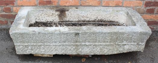 An 18th/19th century granite trough, of rectangular form, with drain hole to the interior, scored
