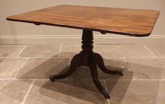 A mahogany breakfast table, 19th century, the rectangular top with rounded corners upon four