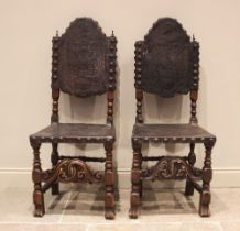 A pair of 17th century and later walnut hall chairs, each with an arched and embossed leather back