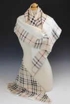 A Burberry silk scarf, designed as traditional Burberry check with an internal cream border, with