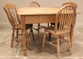 A Victorian style pine kitchen table and four matched chairs, the table with a rectangular moulded