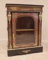 A French ebonised and boulle work vitrine, 19th century, the single glazed door opening to a