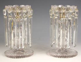 A pair of Victorian lustres, late 19th century, of typical form, with shell cut tops suspending rule