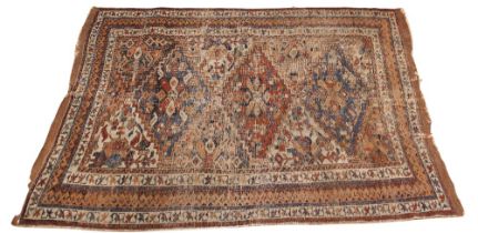 A late 19th century Baluchi wool rug, in red, blue and ivory colourways, with three lozenge shaped