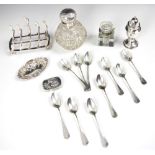 A selection of silver and silver coloured items, including a set of ten silver coloured teaspoons,