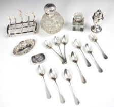 A selection of silver and silver coloured items, including a set of ten silver coloured teaspoons,
