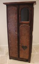 A French elm and fruit wood armoire/cupboard, 19th century, the oversailing cornice above a full