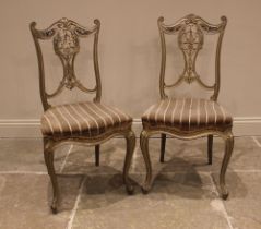 A pair of French style salon chairs, late 19th century, later painted, each with an interlaced splat