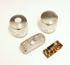 A selection of silver mounted items, including a pair of silver mounted dressing table jars, London,