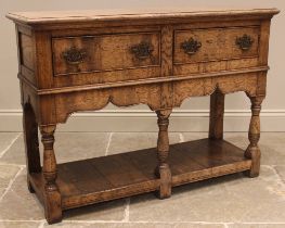 A George III style oak dresser base, late 20th century, in the manner of Titchmarsh and Goodwin, the