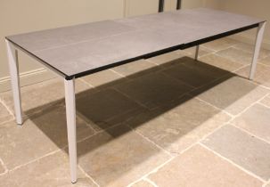 An Italian glass top 'rocker' table, early 21st century, the slate effect rectangular glass top upon