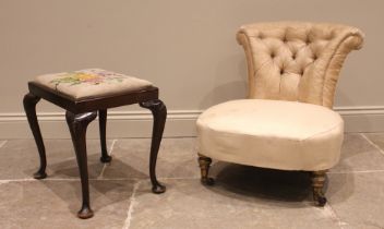 A Victorian low seat upholstered chair, the bow front sprung seat upon gilt wood vase shaped front