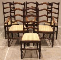 A set of six 18th century style oak ladder back dining chairs, mid 20th century, each with a drop-in
