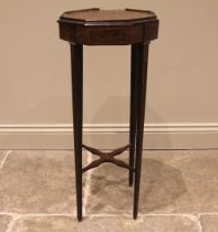 An inlaid mahogany plant stand, late 19th/early 20th century, the octagonal top inlaid with a flower