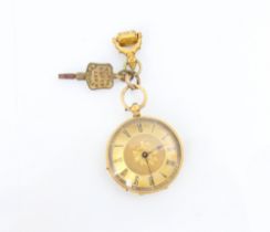 A late 19th century yellow metal ladies fob watch, the gold coloured dial with central engraved